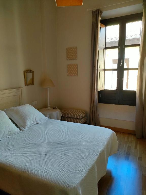 Posteľ alebo postele v izbe v ubytovaní Apartamento Nueva del Santísimo