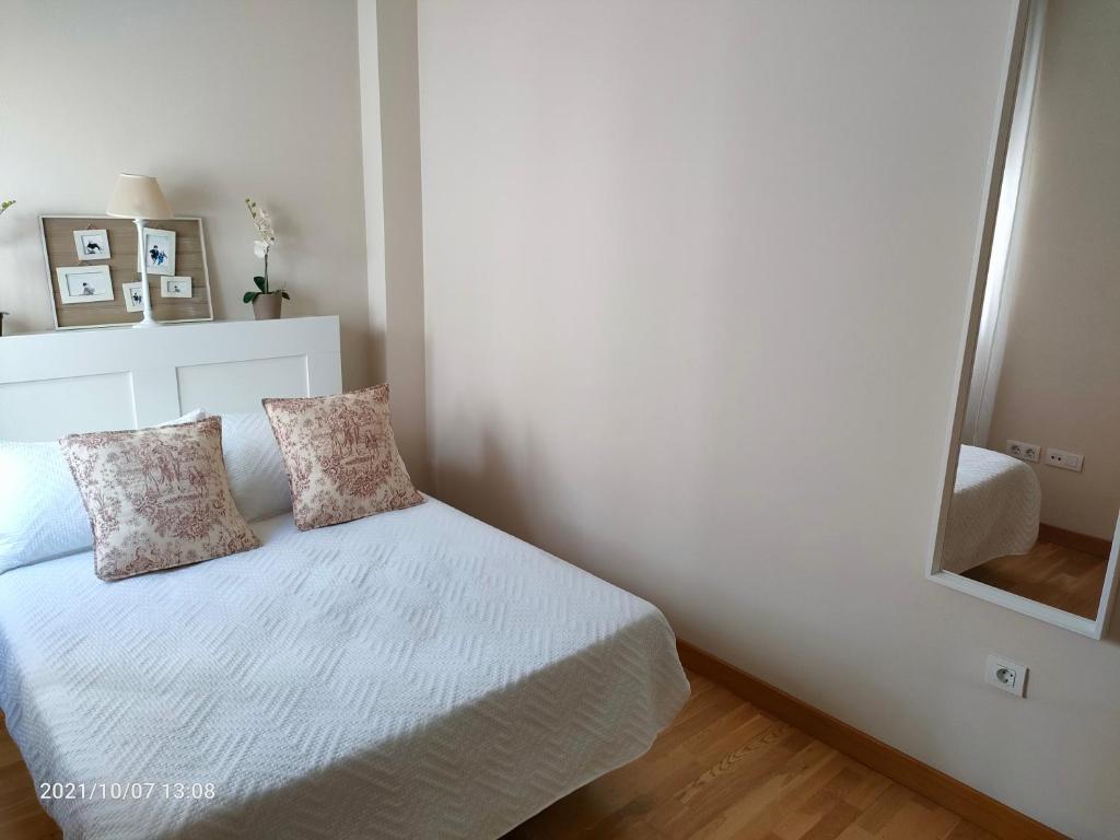 Posteľ alebo postele v izbe v ubytovaní Apartamento Nueva del Santísimo