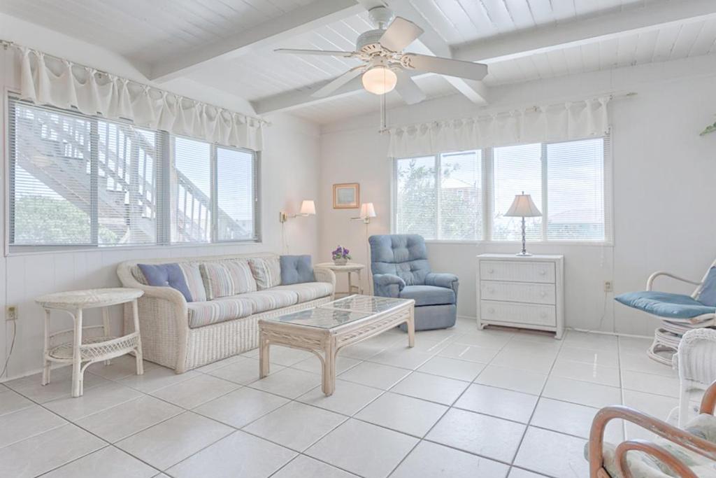 a living room with a couch and a table at Campbellot by Meyer Vacation Rentals in Fort Morgan