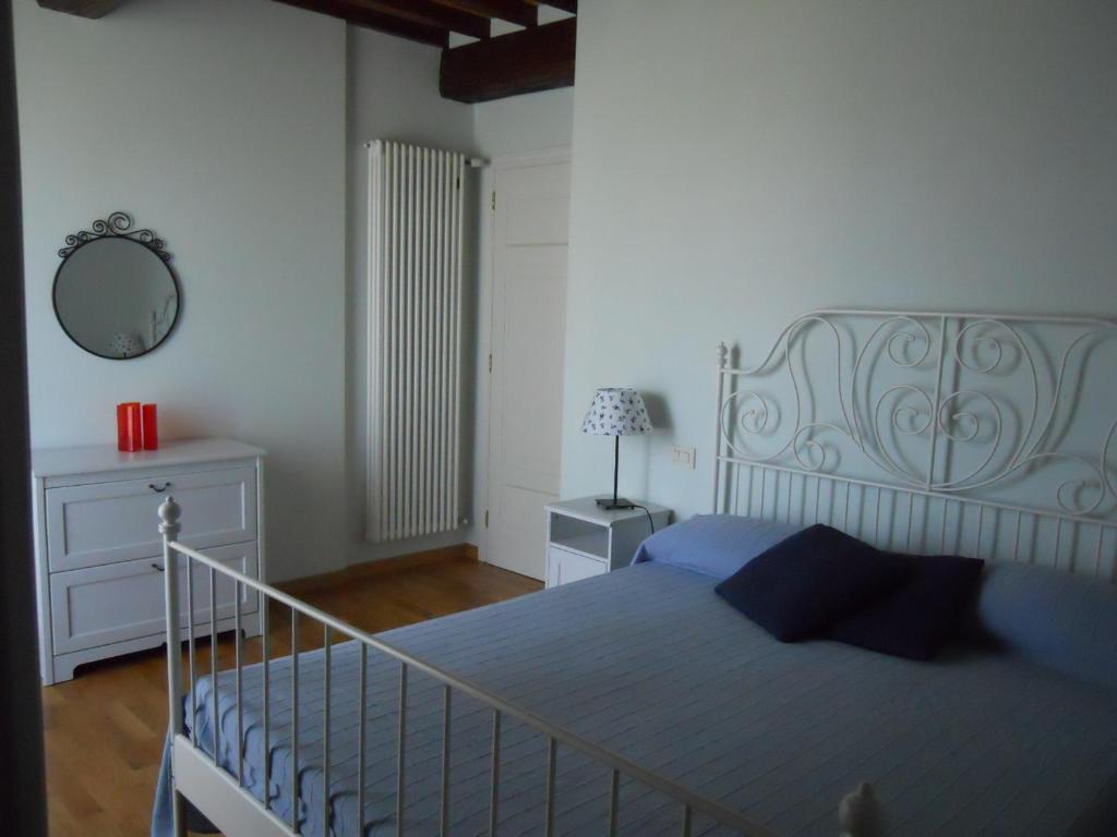 Łóżko lub łóżka w pokoju w obiekcie Villa Le Farfalle