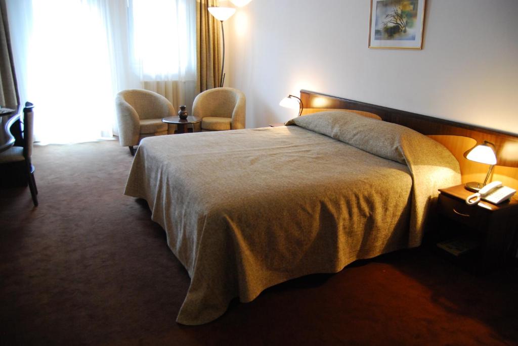 Postel nebo postele na pokoji v ubytování Hotel Maria