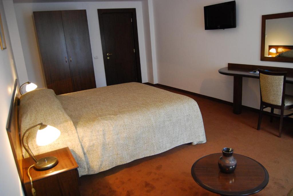 Postel nebo postele na pokoji v ubytování Hotel Maria