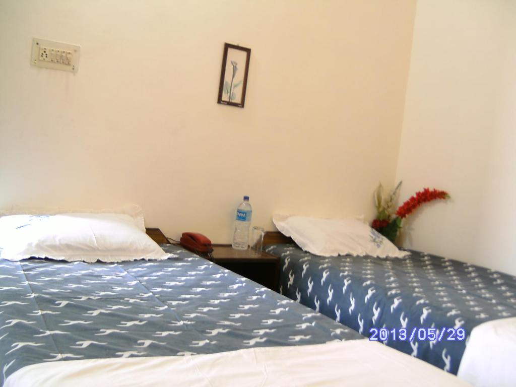 Postel nebo postele na pokoji v ubytování Agra Paying Guest House