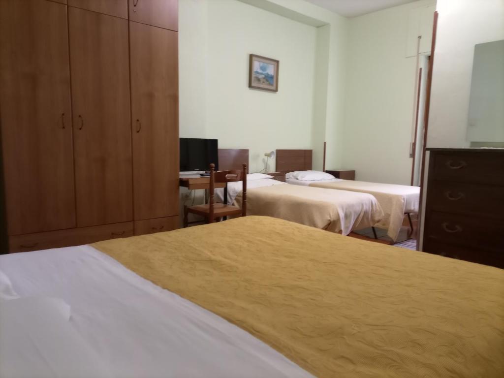 Ένα ή περισσότερα κρεβάτια σε δωμάτιο στο La Lucciola Albergo Ristorante