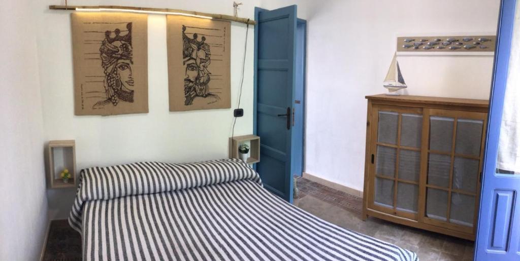 Postel nebo postele na pokoji v ubytování Porta dei Mari