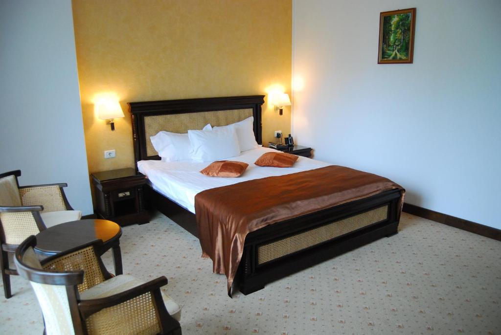 Postel nebo postele na pokoji v ubytování Hotel Zodiac
