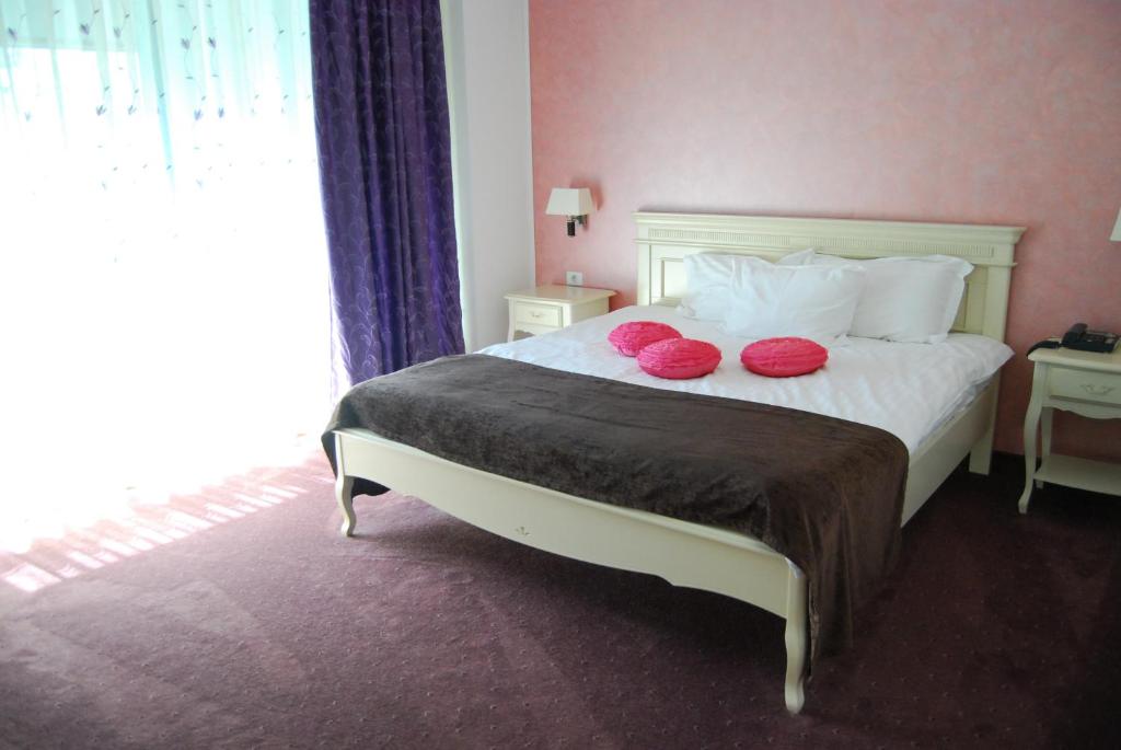 Postel nebo postele na pokoji v ubytování Hotel Zodiac