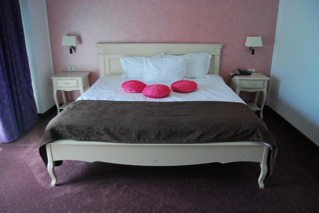 Postel nebo postele na pokoji v ubytování Hotel Zodiac