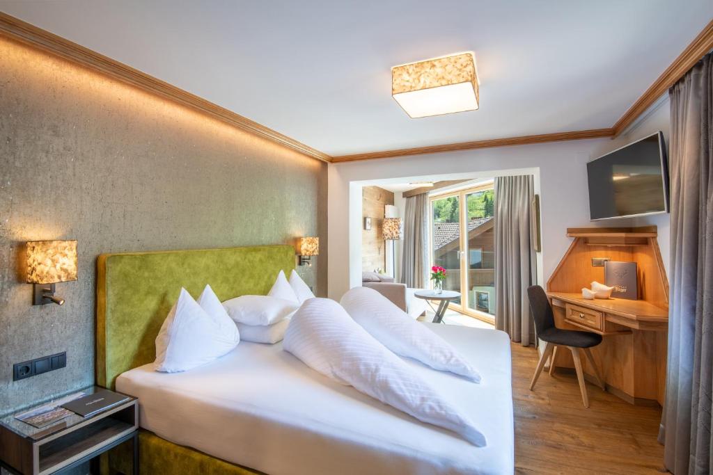 Postel nebo postele na pokoji v ubytování Hotel Jäger 3Sterne Superior
