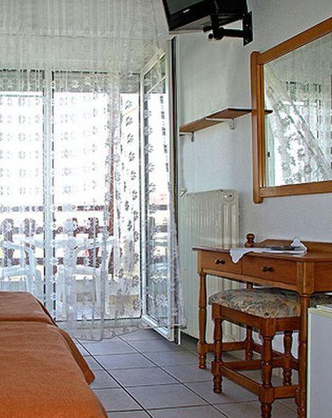 Postel nebo postele na pokoji v ubytování Hotel Helios