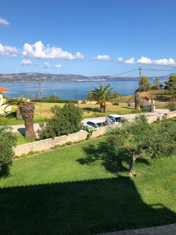 a view of the ocean from a house at Aloni Studios and Apartments in Lassi