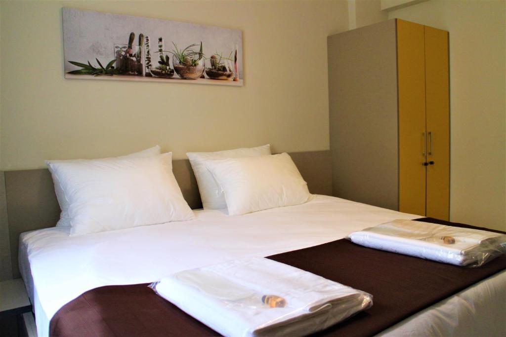Postel nebo postele na pokoji v ubytování Moda Hotel