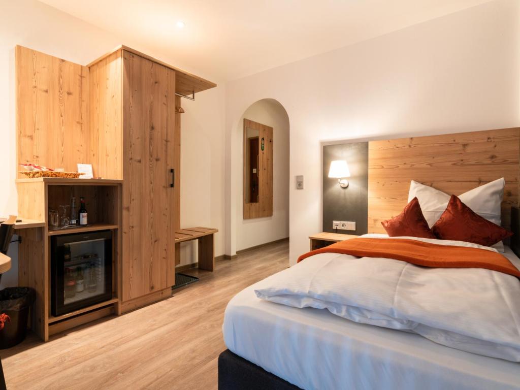 Postel nebo postele na pokoji v ubytování Hotel Heißenhof