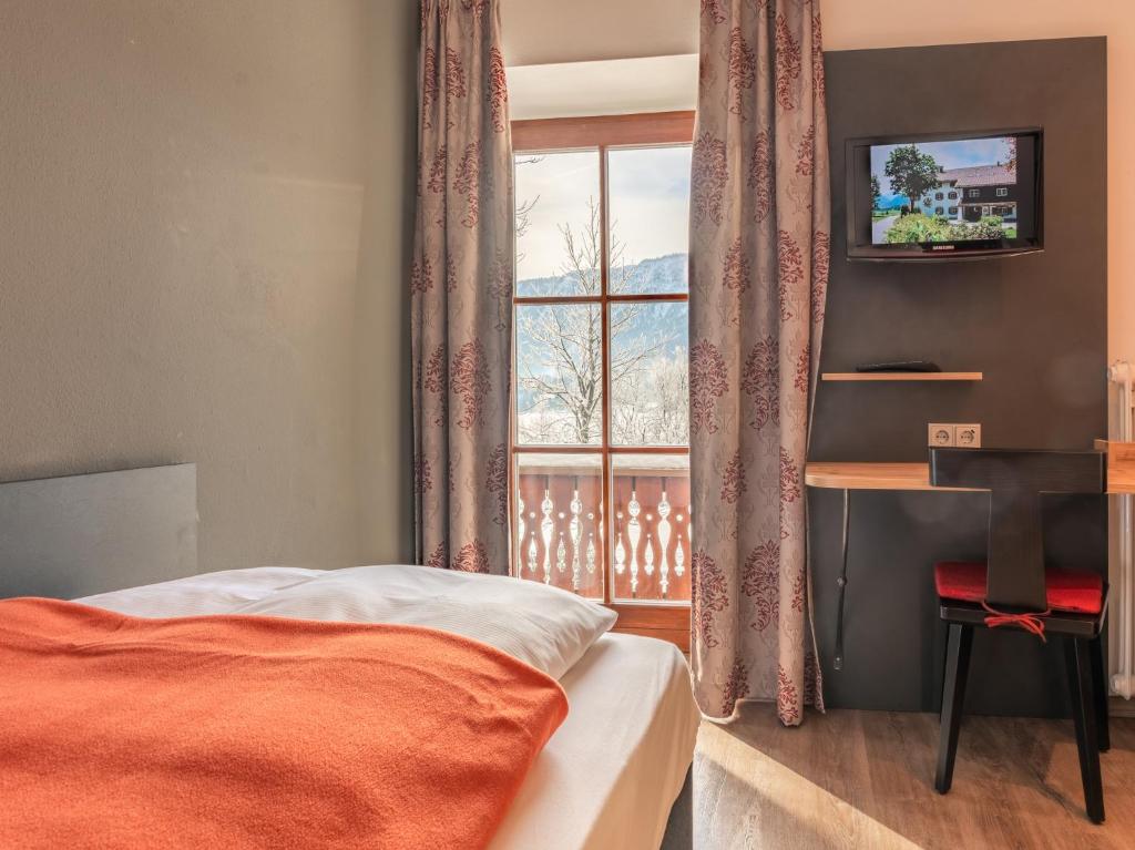 Postel nebo postele na pokoji v ubytování Hotel Heißenhof