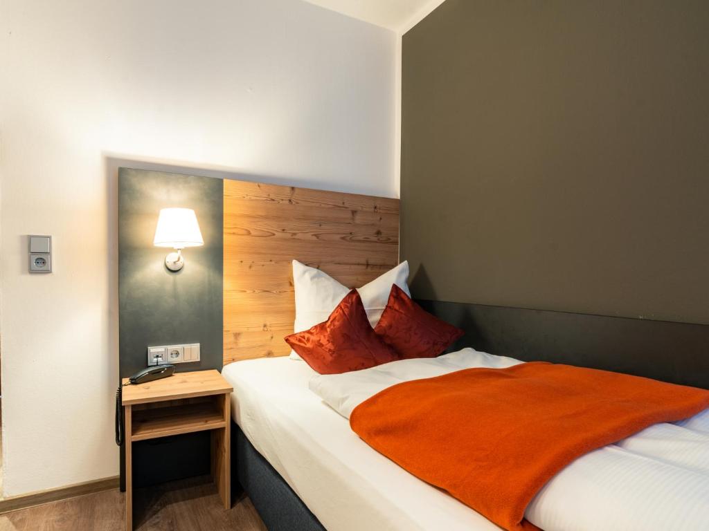 Postel nebo postele na pokoji v ubytování Hotel Heißenhof