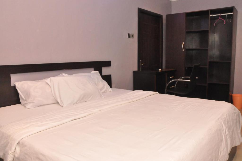 Rúm í herbergi á Haute Aparthotel