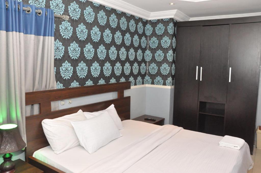 Rúm í herbergi á Haute Aparthotel