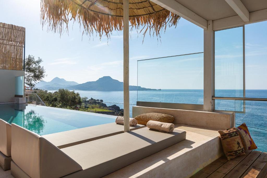 a living room with a view of the ocean at Fotinari Villas in Sellía