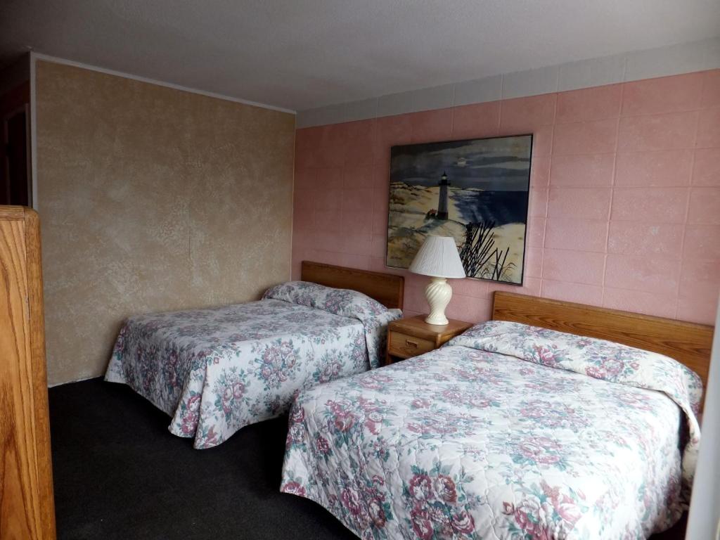 Postel nebo postele na pokoji v ubytování Windsor Motel