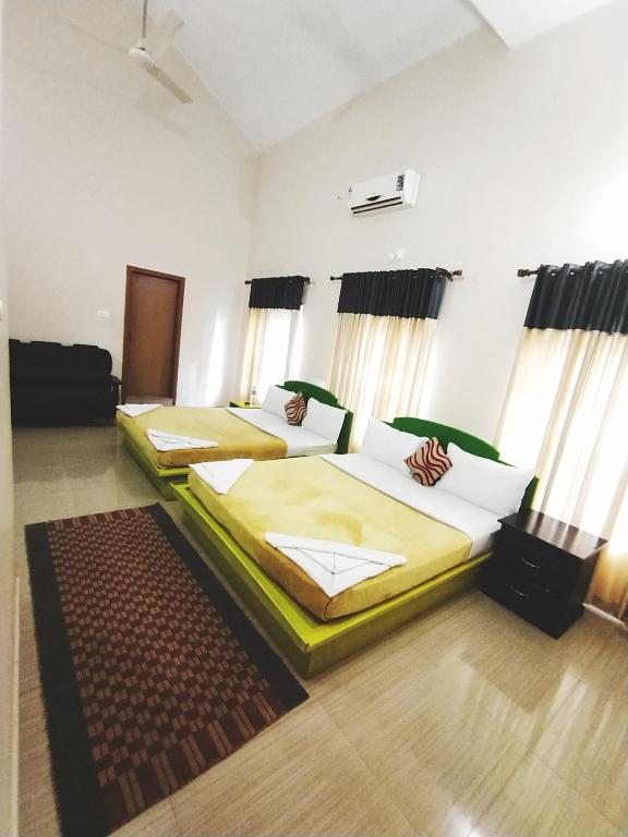 Postel nebo postele na pokoji v ubytování Dreamnest Residency