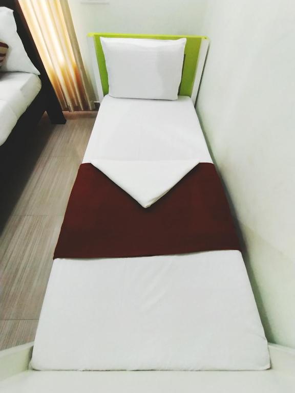 Postel nebo postele na pokoji v ubytování Dreamnest Residency