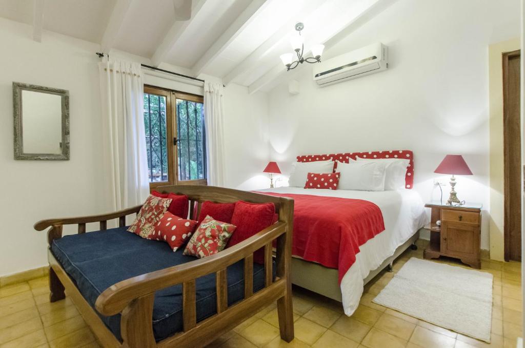 Postel nebo postele na pokoji v ubytování La Casona Hotel Boutique