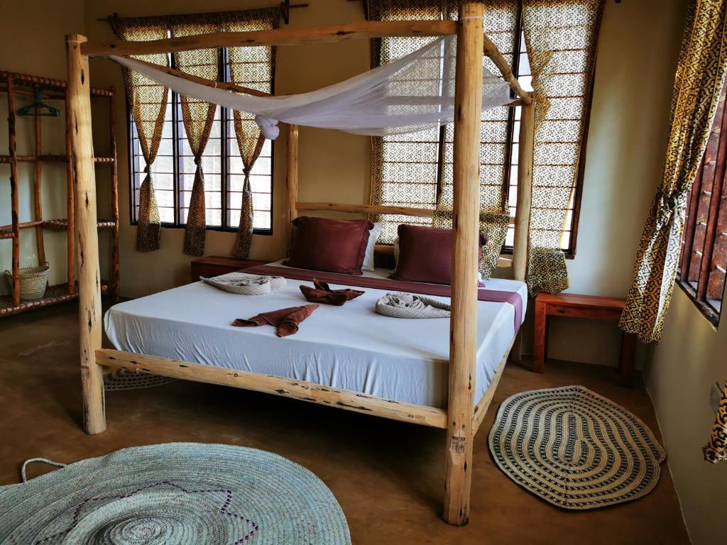 Säng eller sängar i ett rum på Shanka Lodge Zanzibar