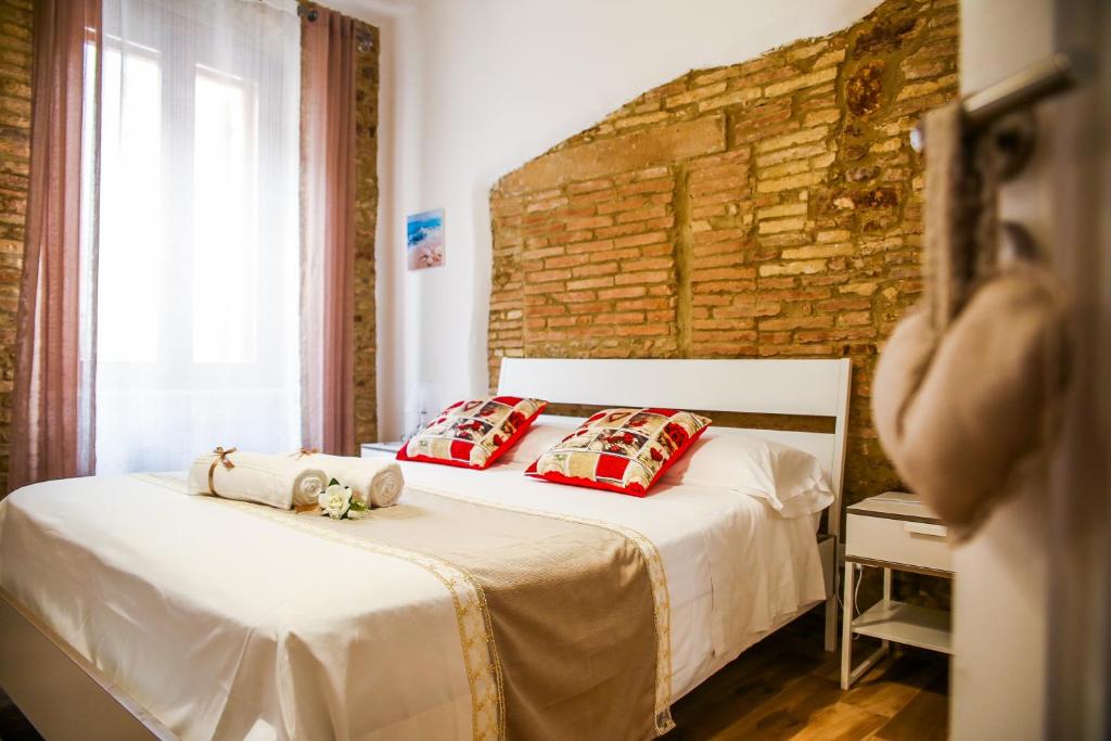 Posteľ alebo postele v izbe v ubytovaní B&B La Dimora di Tommaso Apartment - Dimora storica Bike Friendly