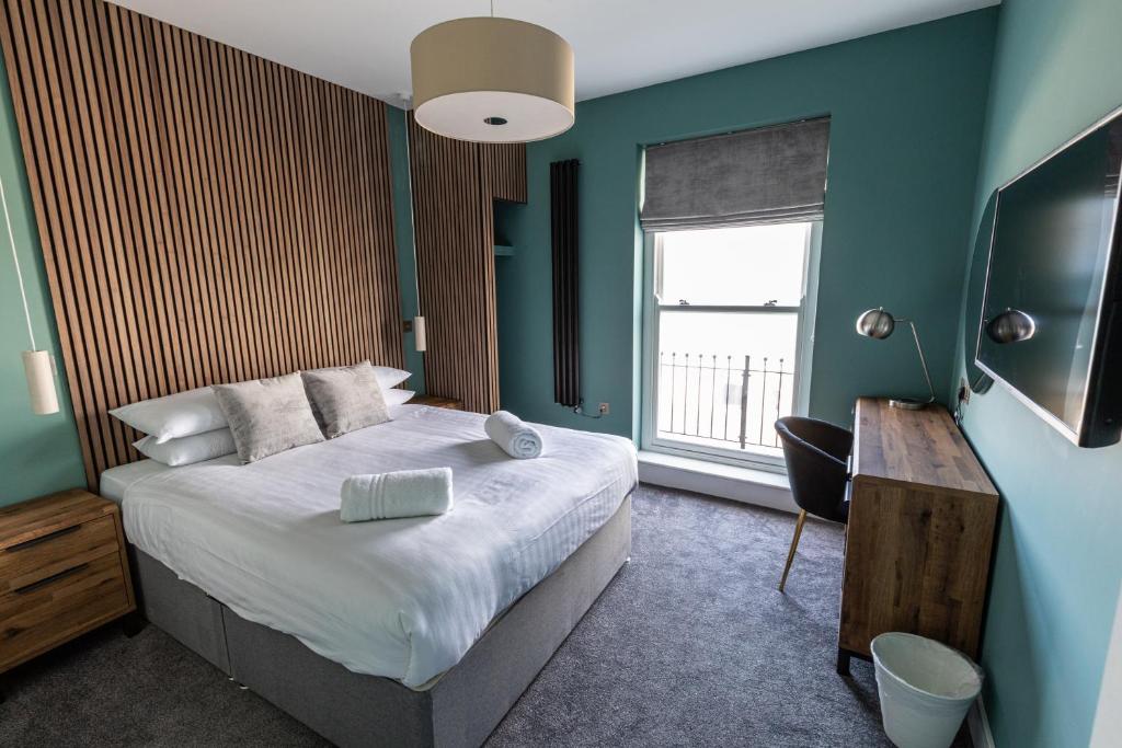 Giường trong phòng chung tại Ty Belgrave - Apartment 3