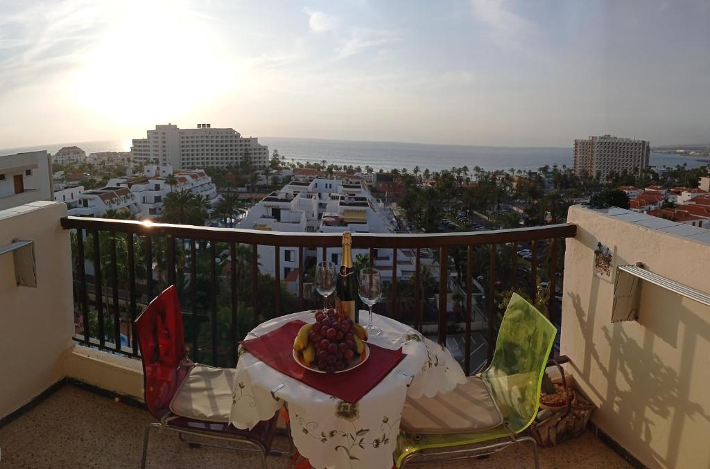a balcony with a table and a view of the ocean at Eldorado Luis 1bedroom ocean view in Playa de las Americas