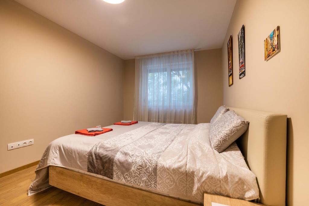 A bed or beds in a room at Apartment City Home