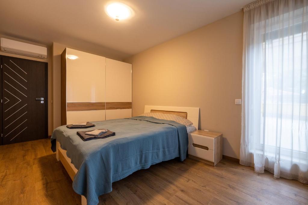 A bed or beds in a room at Apartment City Home
