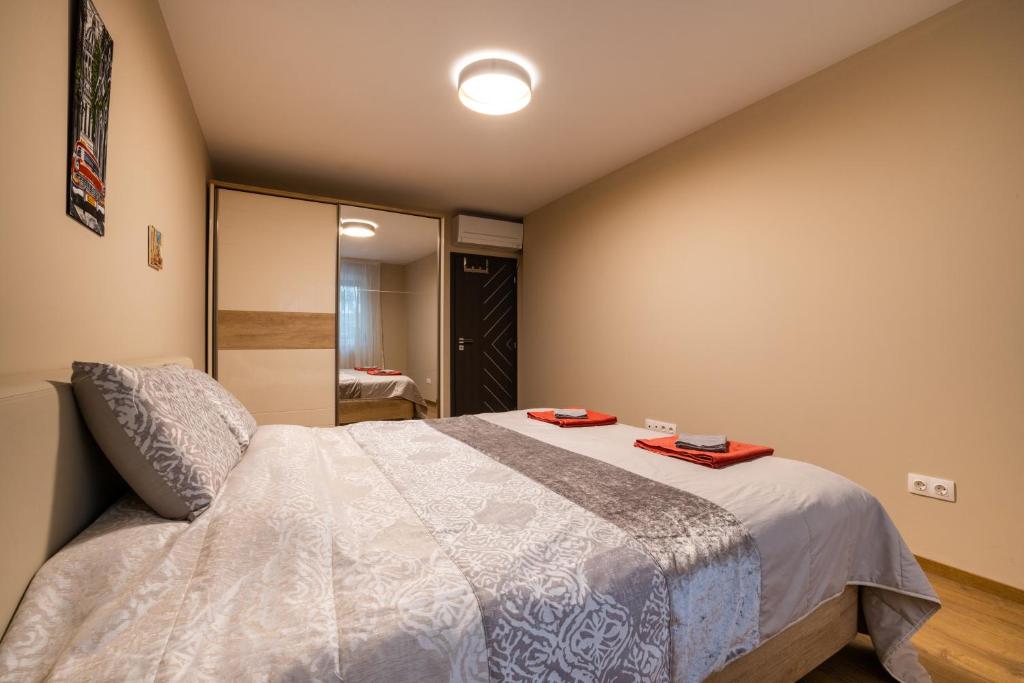 A bed or beds in a room at Apartment City Home