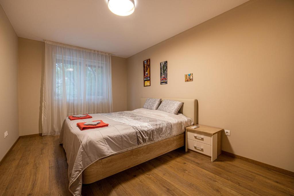 A bed or beds in a room at Apartment City Home