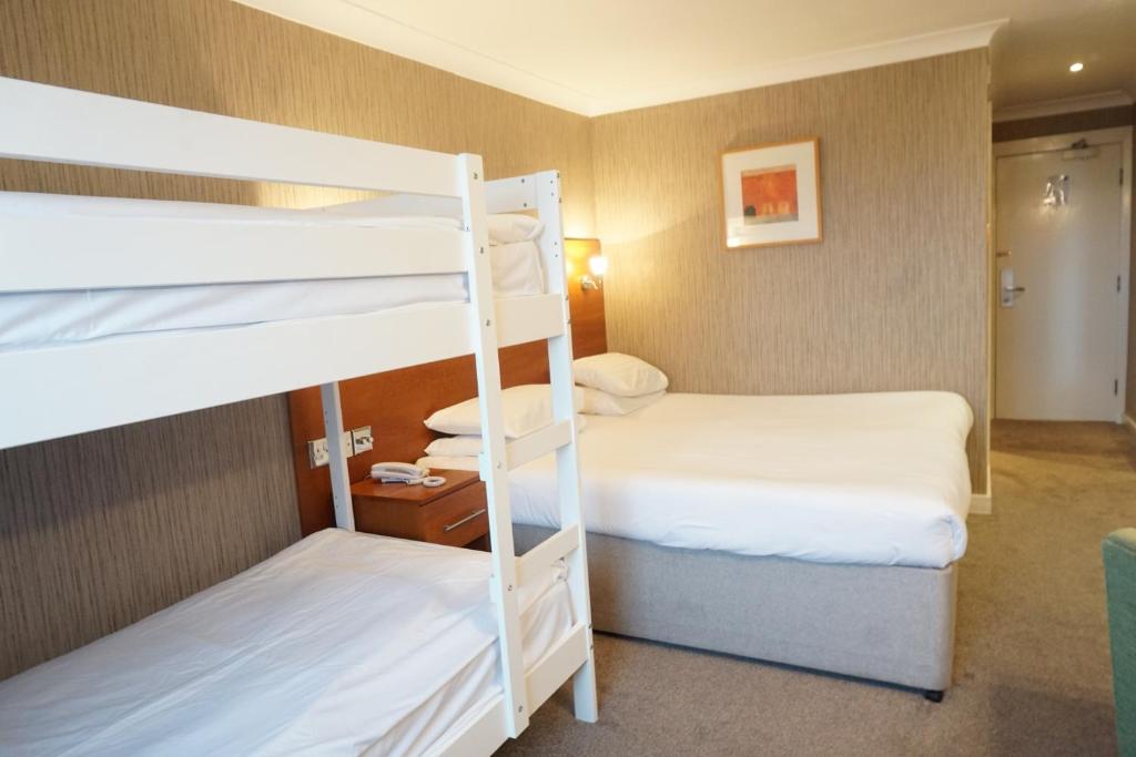 a room with two bunk beds in a hotel at The Park Hotel in Liverpool