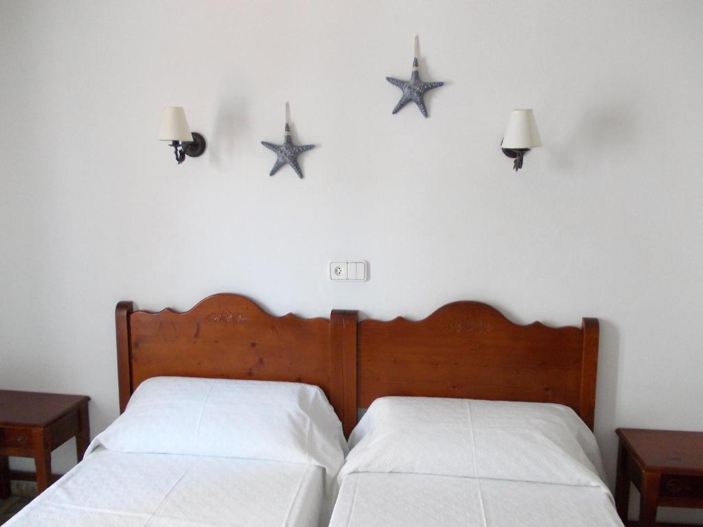 Postel nebo postele na pokoji v ubytování Hostal Rey