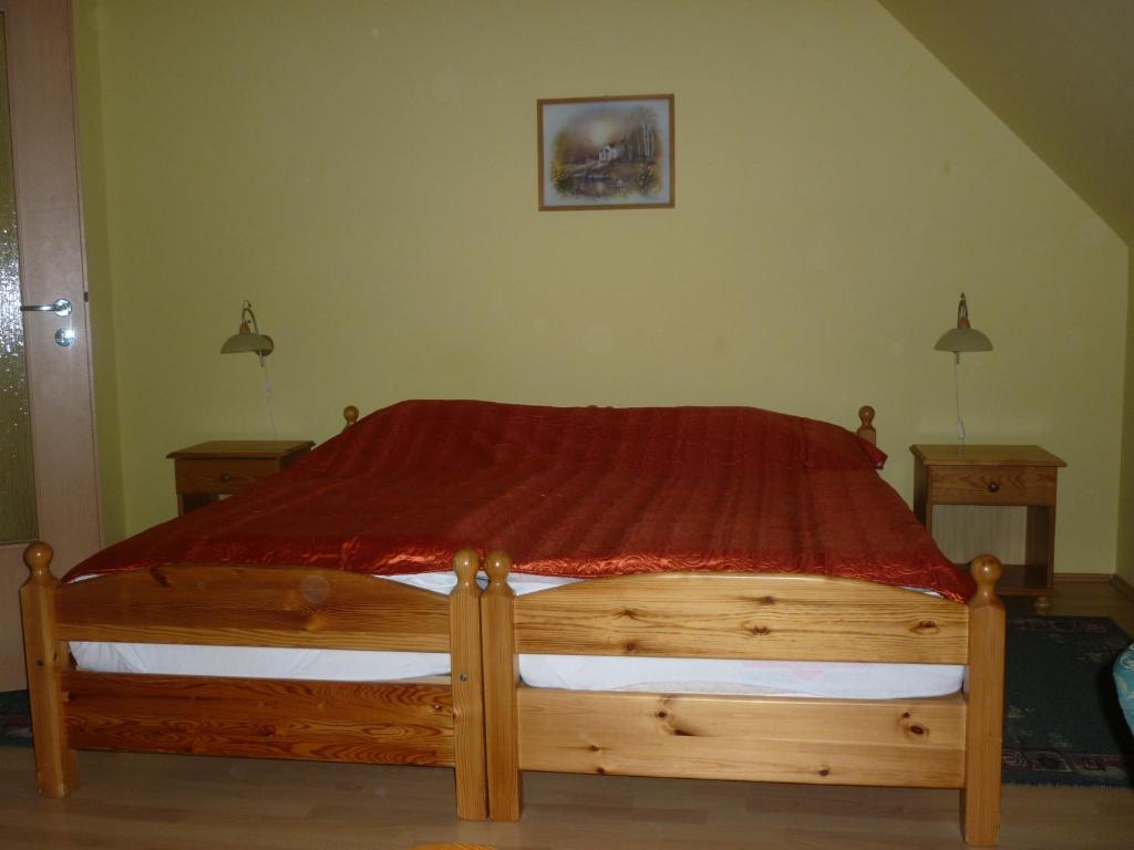 Postel nebo postele na pokoji v ubytování Denis Panzió és Étterem