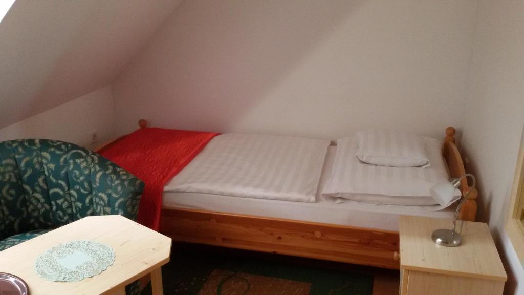 Postel nebo postele na pokoji v ubytování Denis Panzió és Étterem