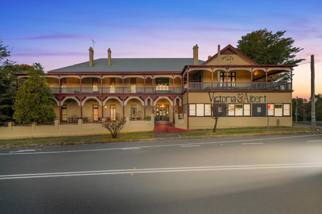 a large building on the side of a street at Victoria and Albert Guesthouse in Mount Victoria
