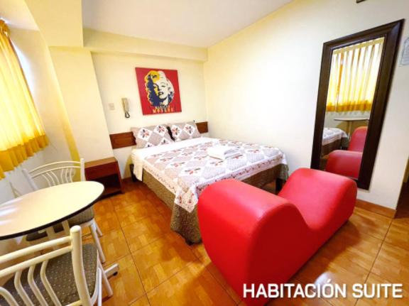 Postel nebo postele na pokoji v ubytování Hostal El Click