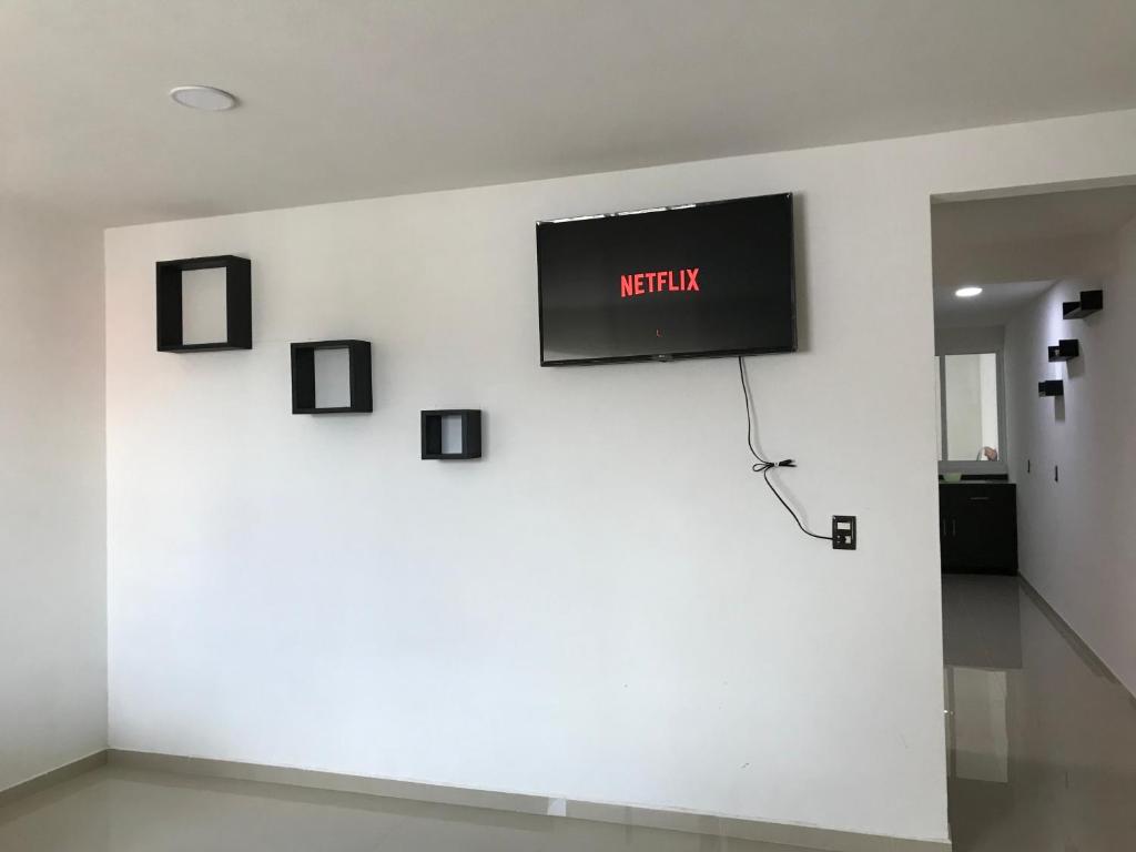 TV a/nebo společenská místnost v ubytování Casa minimalista tranquila y acogedora, con garage