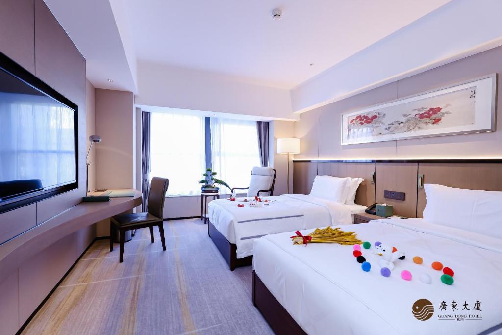 Postel nebo postele na pokoji v ubytování Beijing Guangdong Hotel