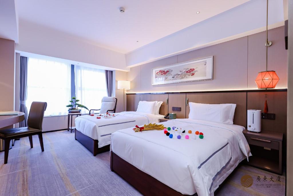 Postel nebo postele na pokoji v ubytování Beijing Guangdong Hotel