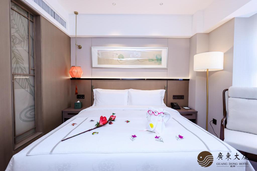 Postel nebo postele na pokoji v ubytování Beijing Guangdong Hotel