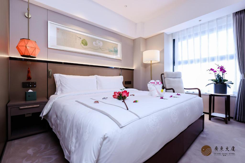 Postel nebo postele na pokoji v ubytování Beijing Guangdong Hotel