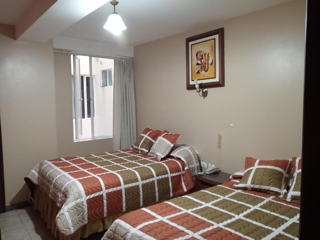 Postel nebo postele na pokoji v ubytování Hostal EL CALLEJÓN