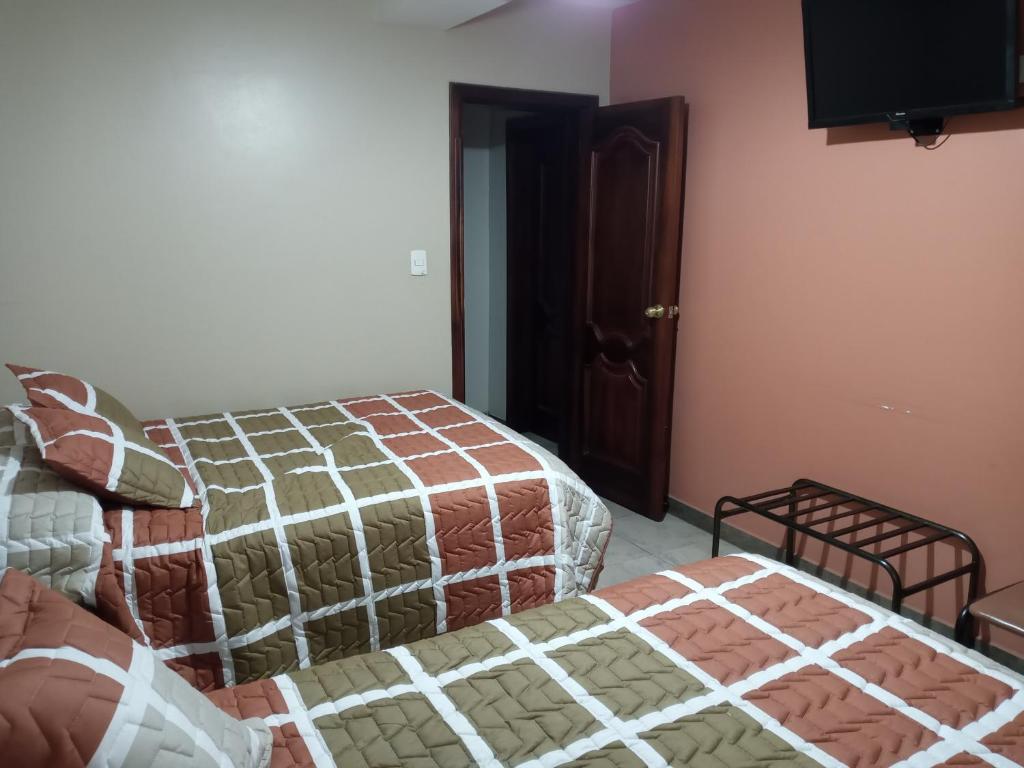 Postel nebo postele na pokoji v ubytování Hostal EL CALLEJÓN