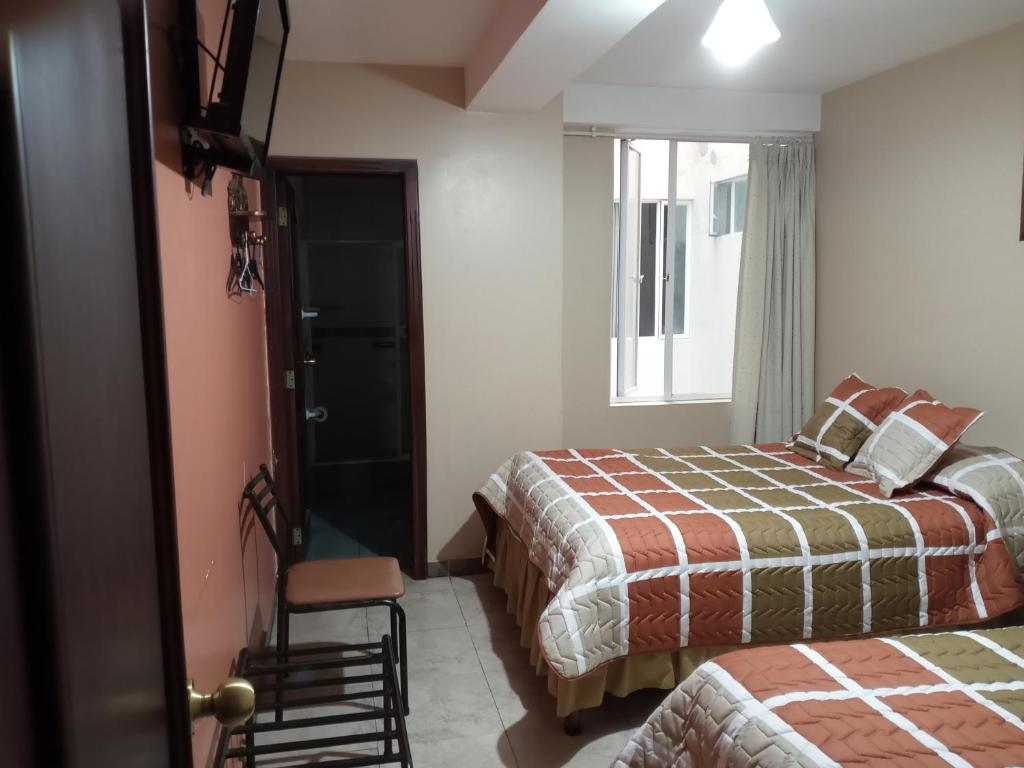 Postel nebo postele na pokoji v ubytování Hostal EL CALLEJÓN