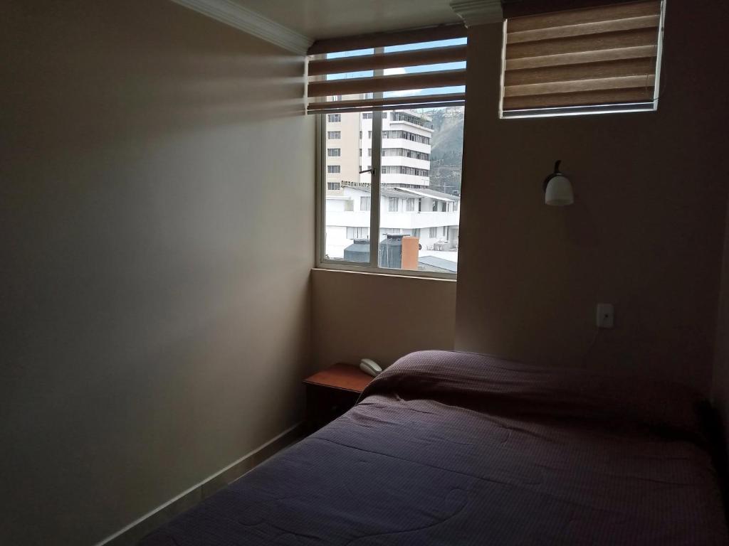 Postel nebo postele na pokoji v ubytování Hostal EL CALLEJÓN