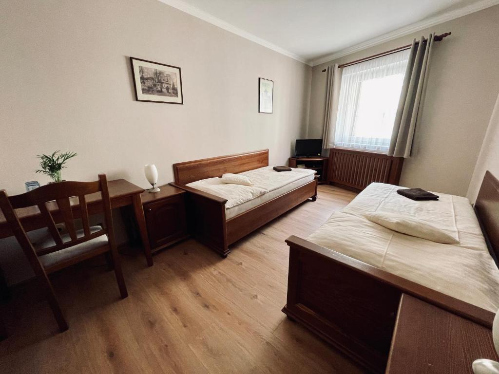 Postel nebo postele na pokoji v ubytování Pension Silvie